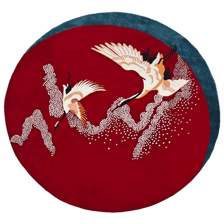 The Crimson Flight hand-tufted round rug showcases dynamic, vivid red patterns that evoke a sense of movement. Its soft wool construction offers both comfort and an artistic focal point for any room.