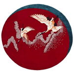 The Crimson Flight hand-tufted round rug showcases dynamic, vivid red patterns that evoke a sense of movement. Its soft wool construction offers both comfort and an artistic focal point for any room.