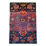 The Dusklight Garden hand-knotted area rug features intricate floral patterns in soft, dusk-inspired hues. Its craftsmanship and luxurious feel add elegance and warmth to any room.