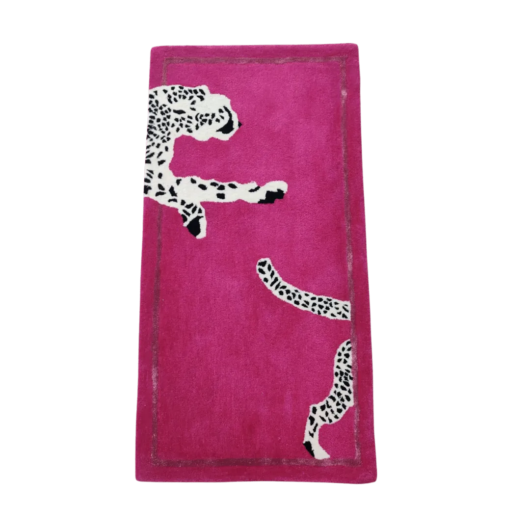 The Walking Wild Cat Leopard on Silk Road hand-tufted wool rug in pink features a vibrant leopard design set against a soft pink backdrop. Its bold pattern and plush wool texture add a playful, luxurious touch to any space.