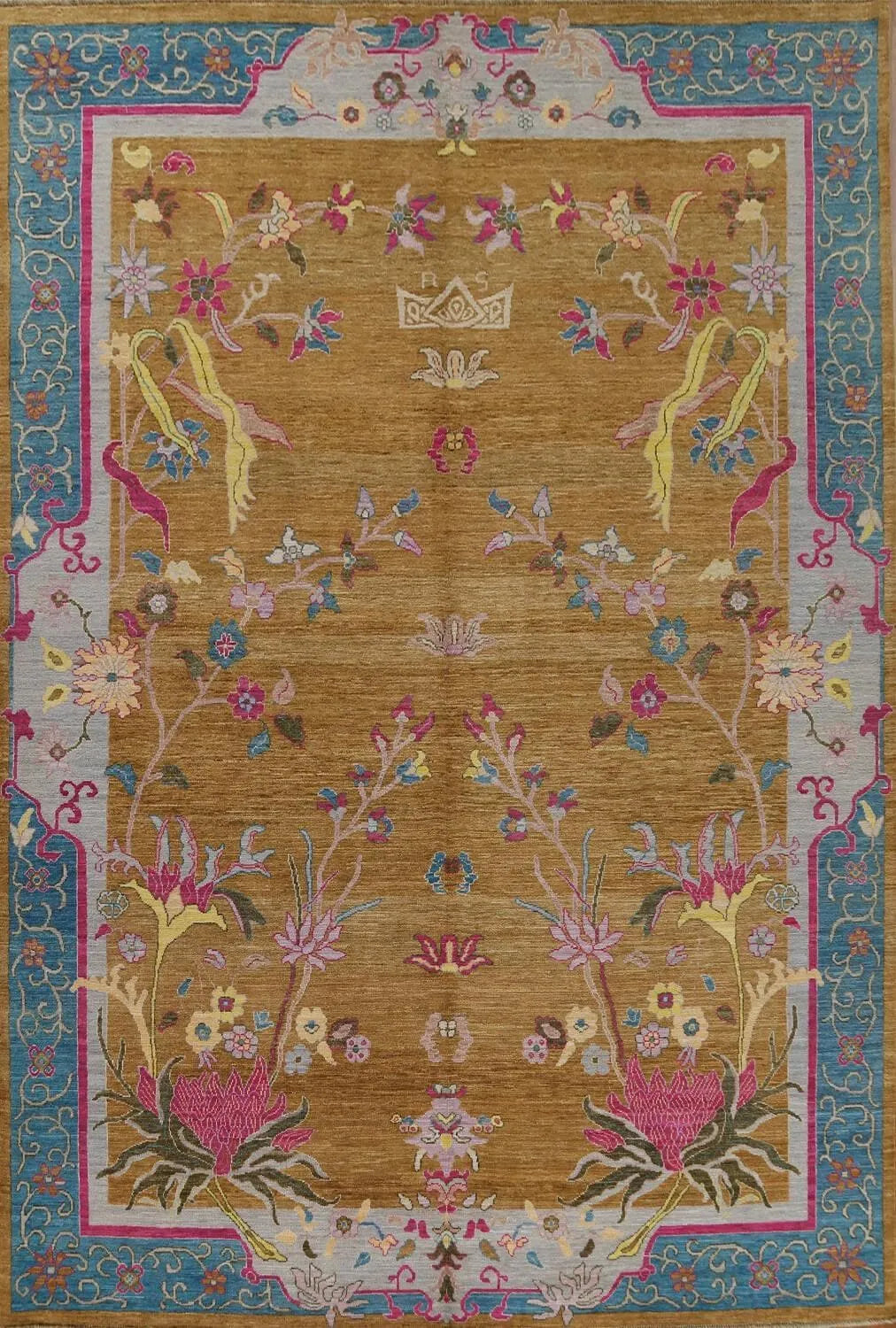 The Red Bordered Spring Floral in the golden  Sky wool hand-knotted area rug features vibrant floral patterns framed by a bold red border. Its intricate craftsmanship and lively design bring freshness and elegance to any space.