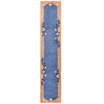 The Chinoiserie Blue Floral wool hand-knotted area rug runner features intricate floral motifs in soothing blue hues. Its expert craftsmanship and elegant design bring a sophisticated, serene touch to any hallway or space.