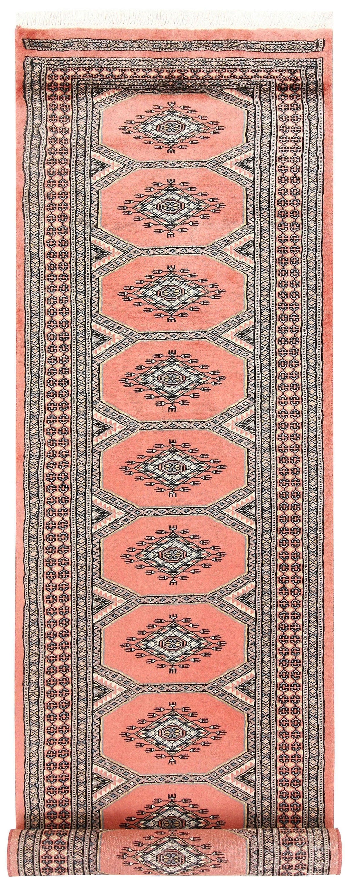 The Moroc Hill wool hand-knotted area rug runner features a blend of traditional Moroccan patterns in earthy tones. Its expert craftsmanship and timeless design bring warmth and style to any hallway or narrow space.