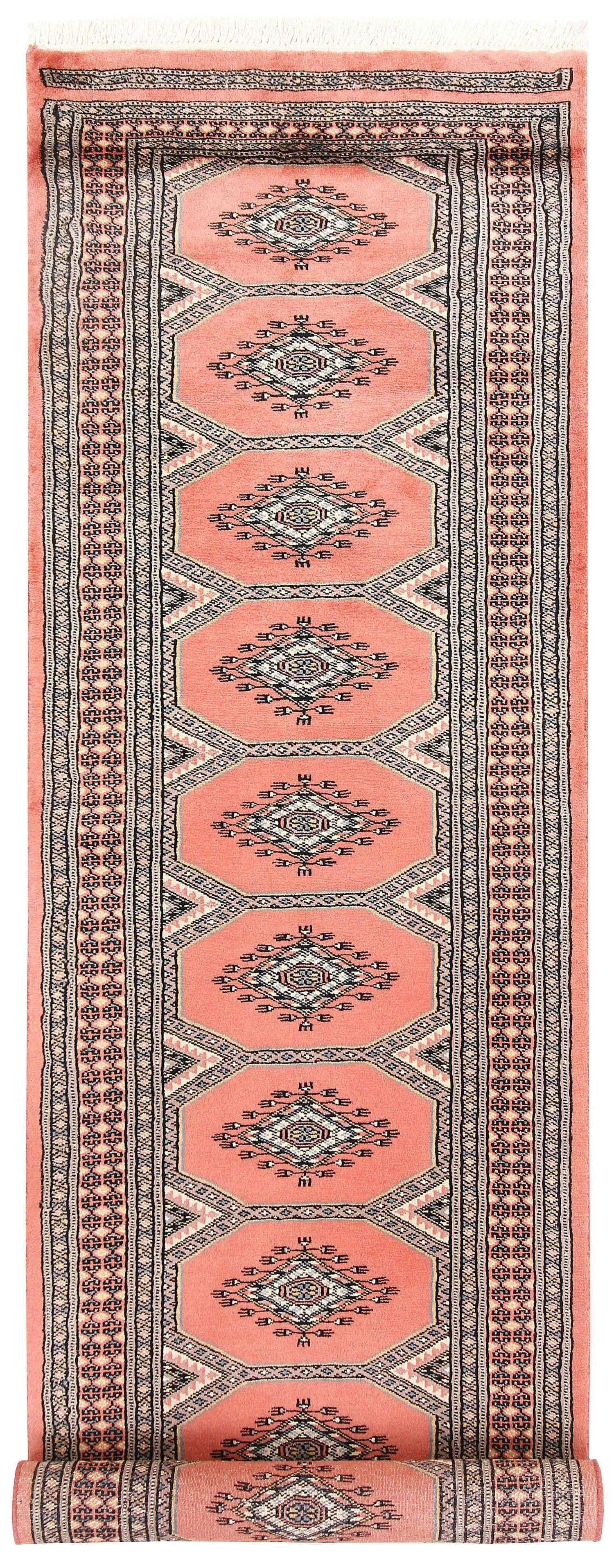 The Moroc Hill wool hand-knotted area rug runner features a blend of traditional Moroccan patterns in earthy tones. Its expert craftsmanship and timeless design bring warmth and style to any hallway or narrow space.