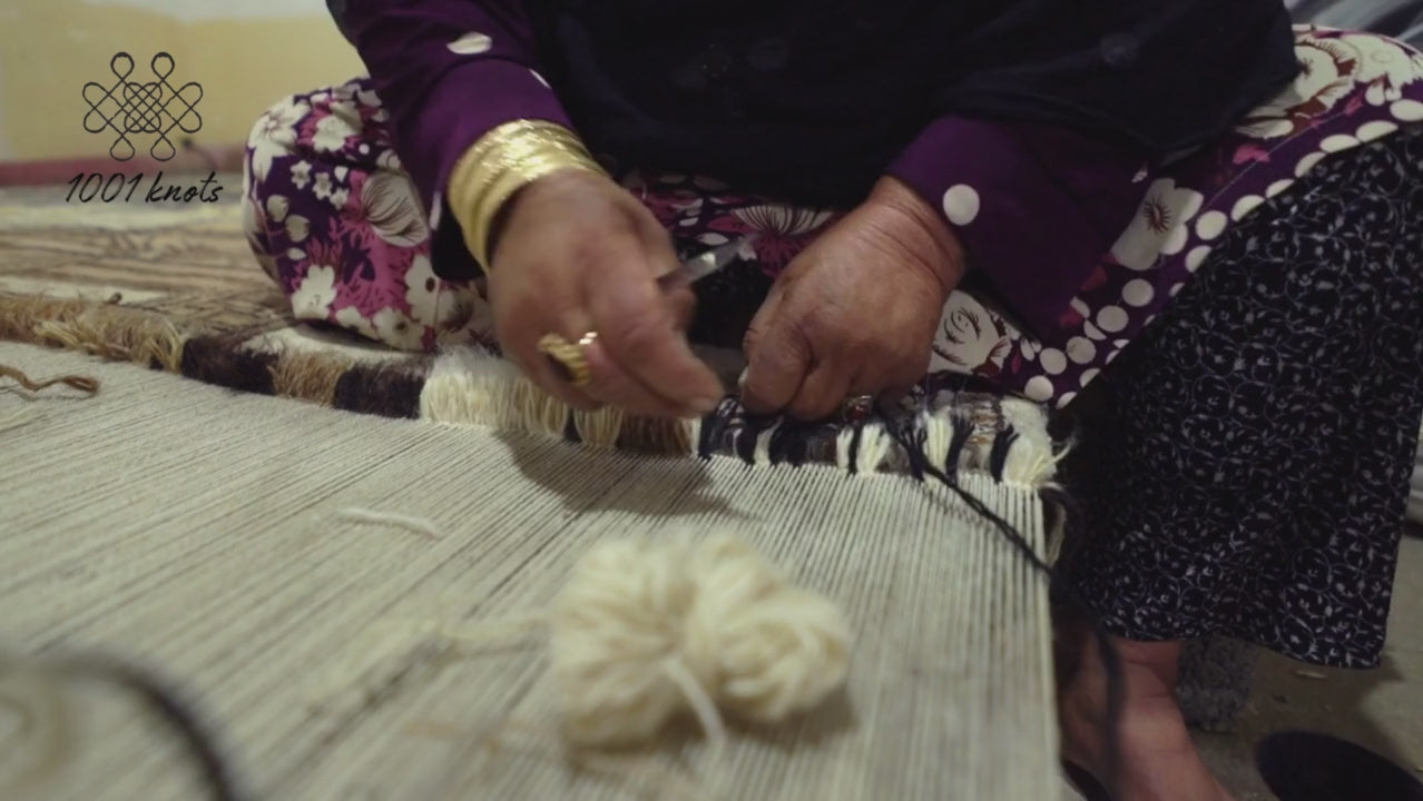 Load video: hand-kotted rug making process