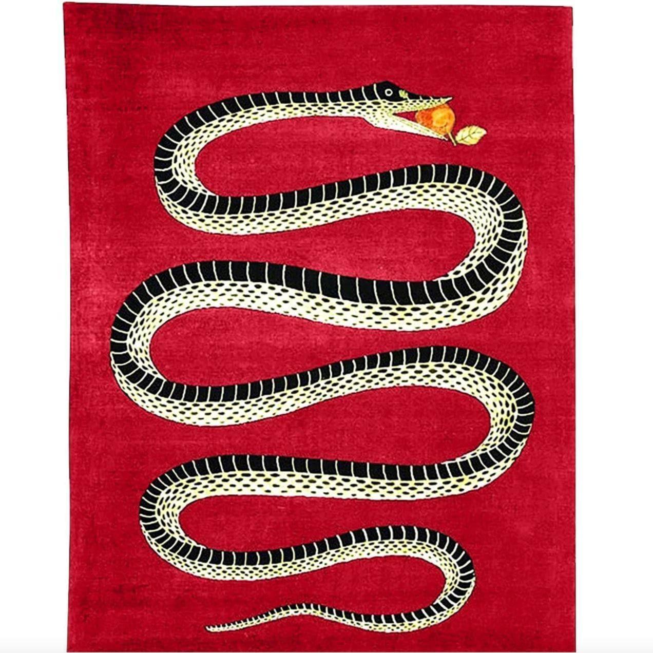 The Retro Red Snake hand-tufted wool rug features a striking snake pattern in vibrant red tones. Its plush wool texture adds a bold, stylish touch to contemporary interiors.