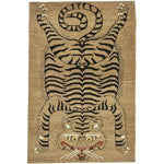 The Tanned Jungle Cat hand-tufted wool rug features a bold jungle cat design in warm, earthy tones. Its soft wool texture and striking pattern bring a wild, luxurious touch to any room.