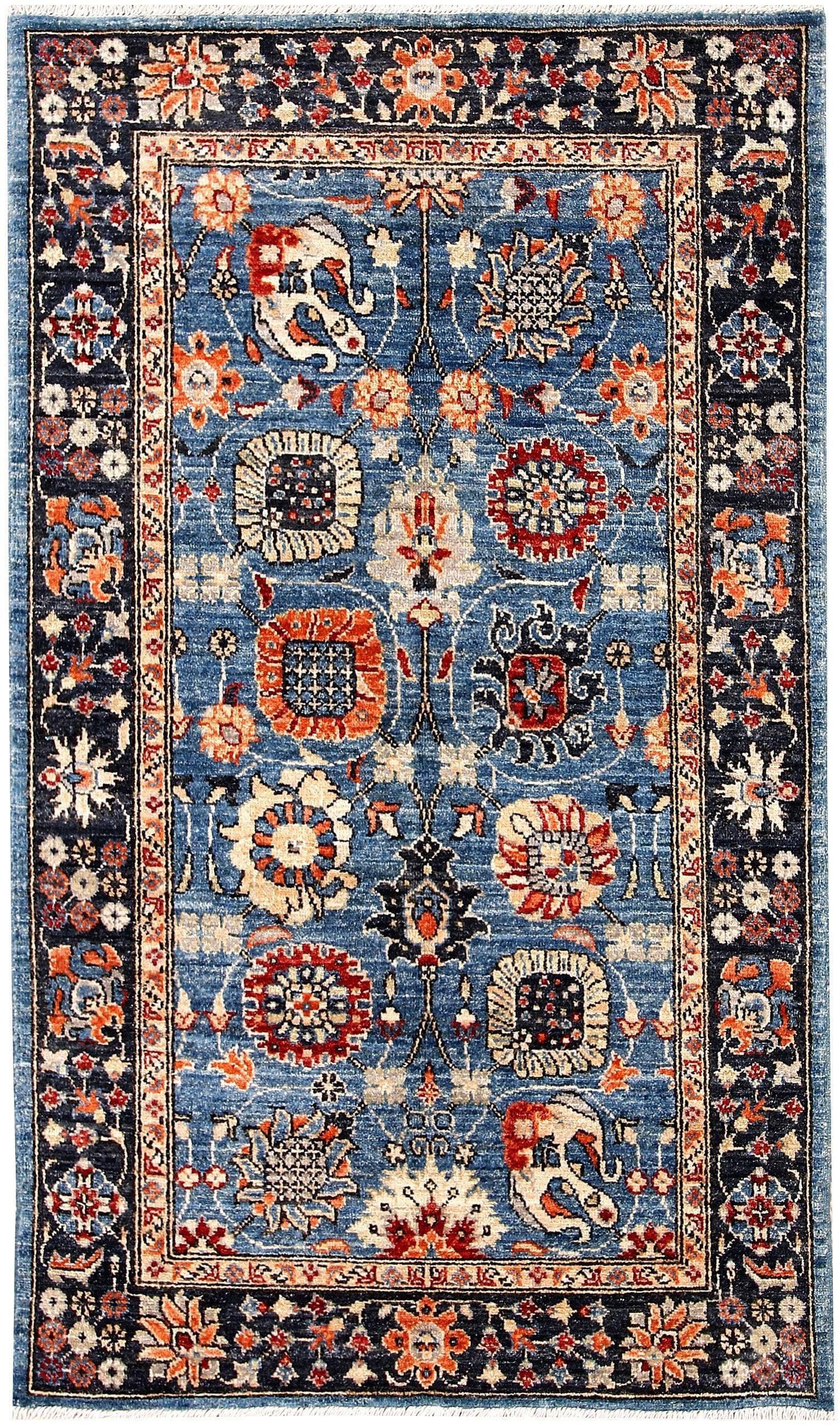 The Tibetan Trees of Life wool hand-knotted area rug runner showcases intricate tree motifs in vibrant, earthy tones. Its craftsmanship and elongated design bring elegance and natural beauty to hallways or narrow spaces.